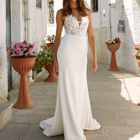 Never worn or altered wedding dress, size 12 but fits a size 4 jeans well. - Picture 4 of 6